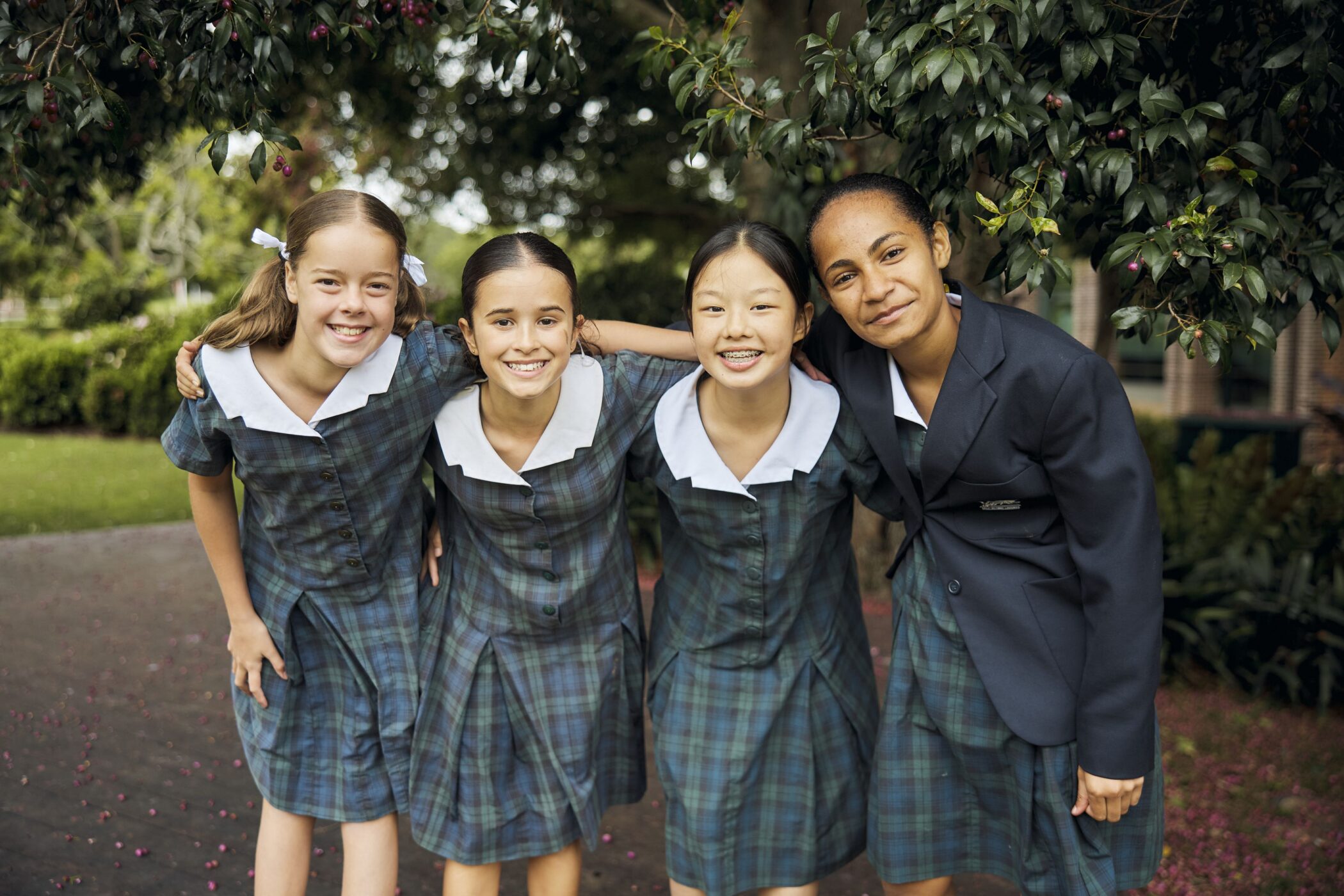 Pymble Ladies College Middle School students smiling together under a tree