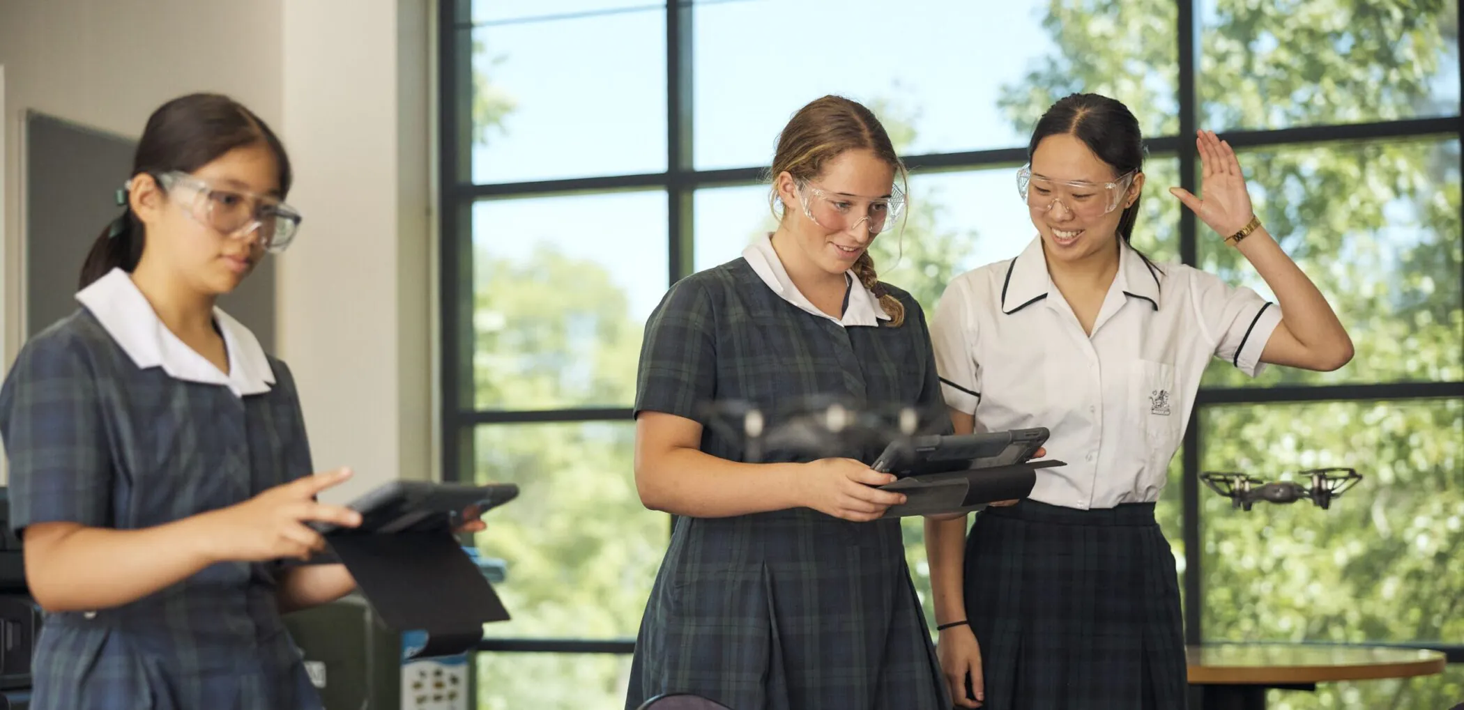 Pymble Ladies College students flying a drone during a technology class