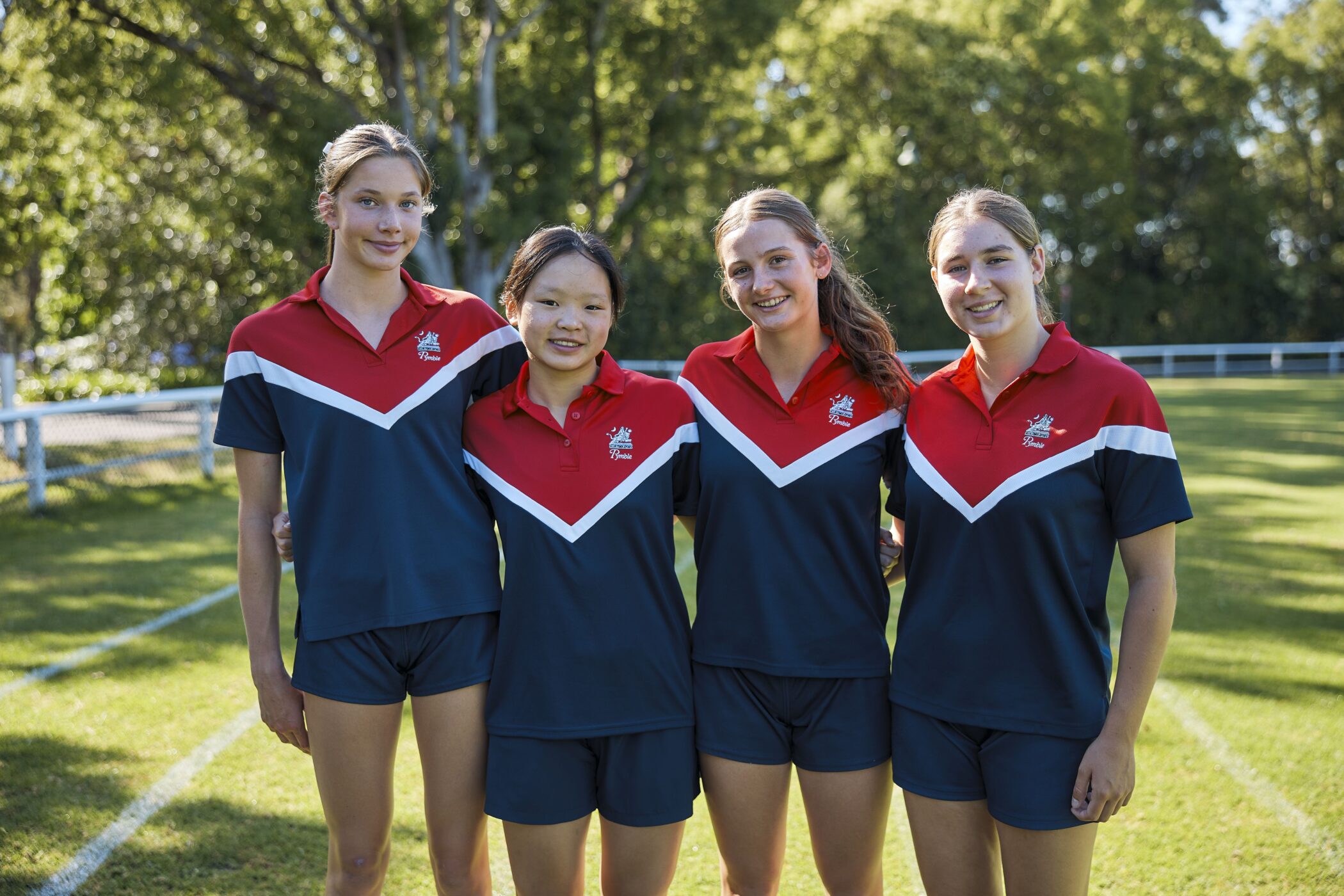 Pymble Ladies College Secondary School students in sports uniform on the playing field